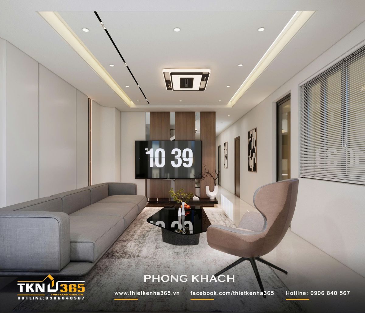 Phòng khách nhà phố 2 tầng sử dụng sofa xám và vách tivi ốp gỗ, tạo bố cục hiện đại và gọn gàng