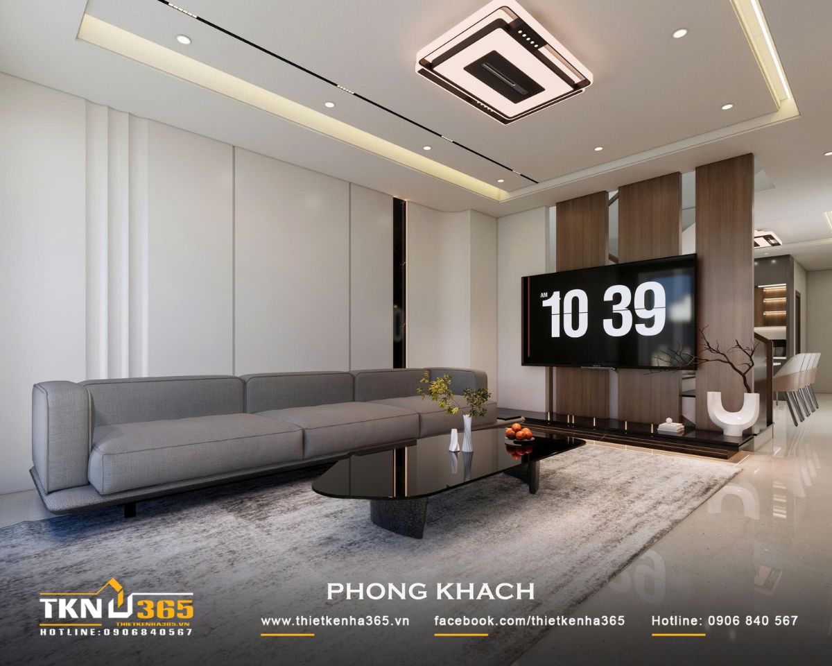 Vách tivi gỗ được thiết kế thanh mảnh, tạo sự phân tách tương đối giữa phòng khách và khu vực phía sau