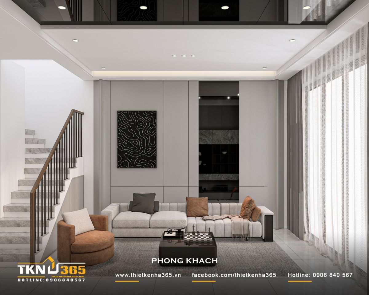 Nhà phố 3 tầng B’S House giữ sự riêng tư trong từng khoảng mở 10 Phòng khách nhà phố 3 tầng B’S House sử dụng sofa chữ L màu sáng, ghế đơn nâu và bàn trà gỗ tối màu, tạo không gian tiếp khách ấm cúng