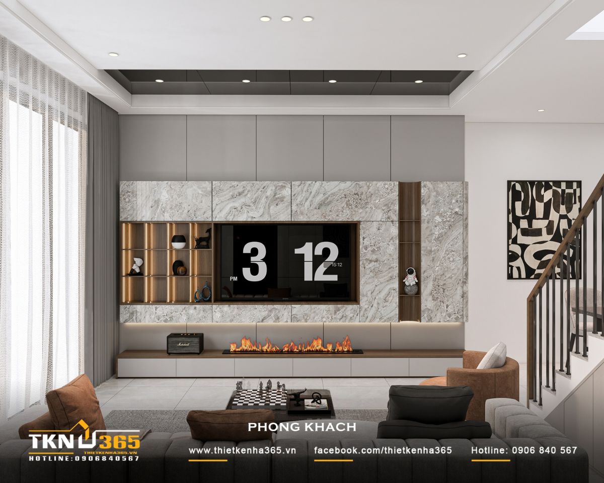 Nhà phố 3 tầng B’S House giữ sự riêng tư trong từng khoảng mở 12 Mảng tường TV ốp đá vân xám kết hợp hộc trang trí bằng gỗ, hệ tủ thấp và ánh sáng hắt tạo chiều sâu cho phòng khách nhà phố 3 tầng