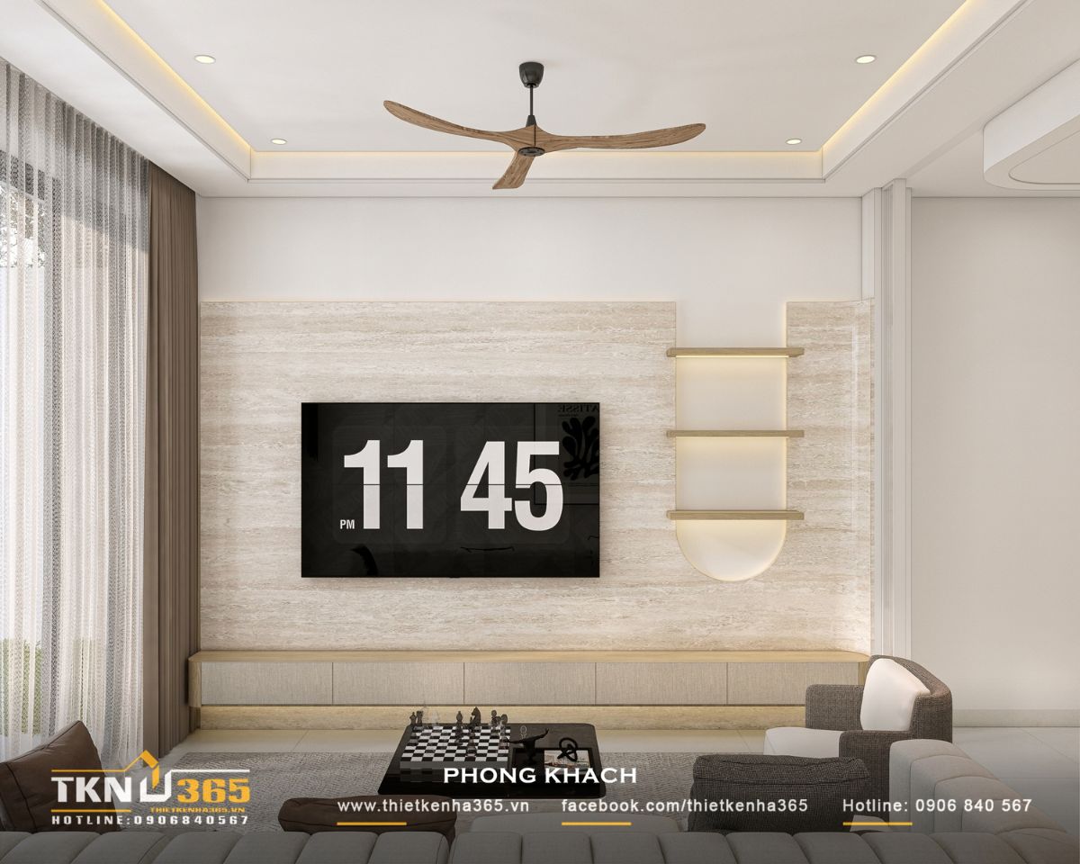 Hệ tủ TV treo tường kết hợp kệ trang trí có đèn hắt giúp phòng khách nhà phố 3 tầng giữ được sự tinh giản và tiện nghi